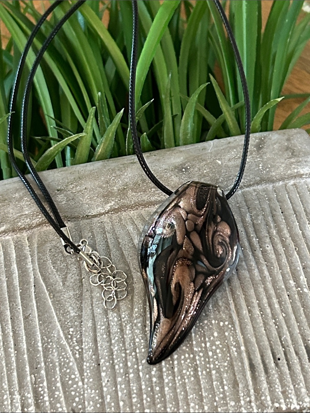 Glass pendant black brown sparkly on a black cord adjustable chain